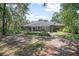 Lush backyard featuring mature trees and landscaping, providing privacy and a tranquil outdoor space at 3357 Black Willow Trl, Deland, FL 32724