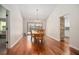 Elegant dining room with hardwood floors and sliding glass doors to the yard at 3357 Black Willow Trl, Deland, FL 32724