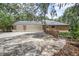 Brick home exterior featuring a three-car garage and well-maintained driveway at 3357 Black Willow Trl, Deland, FL 32724