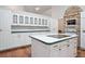 Spacious kitchen featuring a center island with cooktop and white cabinetry at 3357 Black Willow Trl, Deland, FL 32724