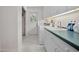 Functional laundry room featuring a washing machine, dryer, sink, and ample cabinet storage at 3357 Black Willow Trl, Deland, FL 32724