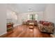 Open living room with high ceilings, hardwood floors, and ample seating at 3357 Black Willow Trl, Deland, FL 32724
