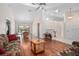 Spacious living room with a ceiling fan and hardwood floors, perfect for entertaining at 3357 Black Willow Trl, Deland, FL 32724