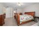 Bedroom with a sleigh bed and carpet flooring at 3357 Black Willow Trl, Deland, FL 32724