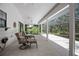 Large screened patio with outdoor seating, offering ample space for entertaining and enjoying the outdoors at 3357 Black Willow Trl, Deland, FL 32724