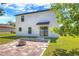 A beautiful patio with a fire pit is nestled in the expansive yard of this two-story home at 348 Southern Winds Blvd, Deland, FL 32720