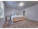 Spacious bedroom features a light-wood bed frame and neutral walls at 348 Southern Winds Blvd, Deland, FL 32720