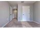 Neutral-toned bedroom features carpeting and an open doorway at 348 Southern Winds Blvd, Deland, FL 32720