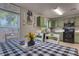 Charming eat-in kitchen with modern black appliances, laminate flooring, and stylish decor and accents at 348 Southern Winds Blvd, Deland, FL 32720