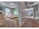 A hallway leads into a bedroom with light-green walls and toys at 348 Southern Winds Blvd, Deland, FL 32720