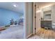 Hallway view of a bedroom with bunkbeds and a bathroom with blue vanity at 348 Southern Winds Blvd, Deland, FL 32720