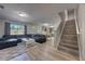 Open-concept floor plan showcases the living room, dining area, kitchen, and staircase to second story at 348 Southern Winds Blvd, Deland, FL 32720