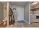 Convenient mud room featuring wood-look flooring, laundry area, and decor at 348 Southern Winds Blvd, Deland, FL 32720