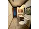 Bathroom featuring a vanity, toilet, and well-placed decor at 37 Meadowwood Trl, Deland, FL 32724