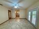 Room with tile floor offers versatility; a bathroom and access to the outdoors further enhance the space at 37 Meadowwood Trl, Deland, FL 32724