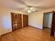 Bedroom with a ceiling fan, hardwood floors, and closet at 37 Meadowwood Trl, Deland, FL 32724