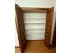 Spacious closet featuring an array of shelving and wood-paneled doors, ideal for optimal storage solutions at 37 Meadowwood Trl, Deland, FL 32724