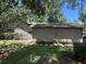 Side of a home showing its siding, landscaping and stone path at 37 Meadowwood Trl, Deland, FL 32724