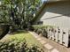 Backyard featuring a well-maintained lawn and a stone pathway at 37 Meadowwood Trl, Deland, FL 32724