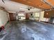 Large garage with water heater, laundry, and cabinets for ample storage space at 37 Meadowwood Trl, Deland, FL 32724