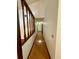 Hallway featuring hardwood flooring and neutral paint tones leading to the various living spaces at 37 Meadowwood Trl, Deland, FL 32724