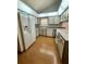 Bright and airy kitchen with white cabinets and appliances at 37 Meadowwood Trl, Deland, FL 32724