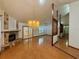 Bright living room featuring wood floors, fireplace, vaulted ceilings, and natural light at 37 Meadowwood Trl, Deland, FL 32724