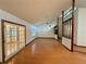 Bright living room featuring wood floors, fireplace, vaulted ceilings, and natural light at 37 Meadowwood Trl, Deland, FL 32724