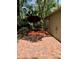 Cozy backyard patio with red umbrella and outdoor seating at 37 Meadowwood Trl, Deland, FL 32724
