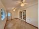 Sunroom with multiple windows and doors for natural light and outside views at 37 Meadowwood Trl, Deland, FL 32724