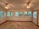 Sunroom with multiple windows and doors for natural light and outside views at 37 Meadowwood Trl, Deland, FL 32724