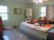 Cozy bedroom with a ceiling fan, natural light, and a neutral color scheme at 3788 Fir Ct, Ormond Beach, FL 32174