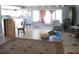 Open-concept living room featuring natural light, tile floors, and plenty of space at 3788 Fir Ct, Ormond Beach, FL 32174