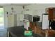 Office area complete with refrigerator, desk, shelving, and storage at 3788 Fir Ct, Ormond Beach, FL 32174