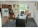 Office area complete with refrigerator, desk, shelving, and a window at 3788 Fir Ct, Ormond Beach, FL 32174