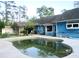 Backyard pool features an in-ground pool and patio area at 3788 Fir Ct, Ormond Beach, FL 32174