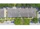 Aerial view of a multi-unit residential building with meticulously maintained roofs and green landscaping at 4297 Regal Town Ln, Lake Mary, FL 32746