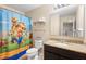 bathroom featuring a single granite vanity with a Mario themed shower curtain at 4297 Regal Town Ln, Lake Mary, FL 32746