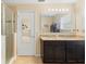 Bathroom featuring a granite vanity with double sinks, and a glass shower at 4297 Regal Town Ln, Lake Mary, FL 32746