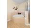 Bathroom featuring a corner tub with tile surround, and a glass shower at 4297 Regal Town Ln, Lake Mary, FL 32746