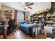 A bedroom featuring shelving, decorations, and laminate wood flooring at 4297 Regal Town Ln, Lake Mary, FL 32746