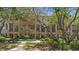 Townhome complex with tree-lined walkways and private balconies at 4297 Regal Town Ln, Lake Mary, FL 32746