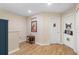 Upstairs hallway with unique artwork, hardwood floors, and natural light from a nearby window at 4297 Regal Town Ln, Lake Mary, FL 32746