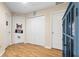 Hallway with wood floors, doors, storage and novelty wall decor at 4297 Regal Town Ln, Lake Mary, FL 32746