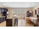 Kitchen with a breakfast bar, stainless steel refrigerator, and a view of the backyard at 4297 Regal Town Ln, Lake Mary, FL 32746