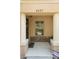 Charming townhouse porch with neutral pillars, stone accent wall and decorative wreath at 4297 Regal Town Ln, Lake Mary, FL 32746