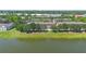 Waterfront townhomes with well-maintained landscaping and serene lake views in a desirable community at 4297 Regal Town Ln, Lake Mary, FL 32746
