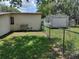 View of backyard, fenced yard, storage shed, and AC unit at 4830 Kempston Dr, Orlando, FL 32812