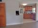 The kitchen has a tiled floor, wooden cabinets, and stainless steel appliances at 4830 Kempston Dr, Orlando, FL 32812