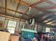 Messy shed interior with a metal roof, and open windows, offering natural light at 4830 Kempston Dr, Orlando, FL 32812